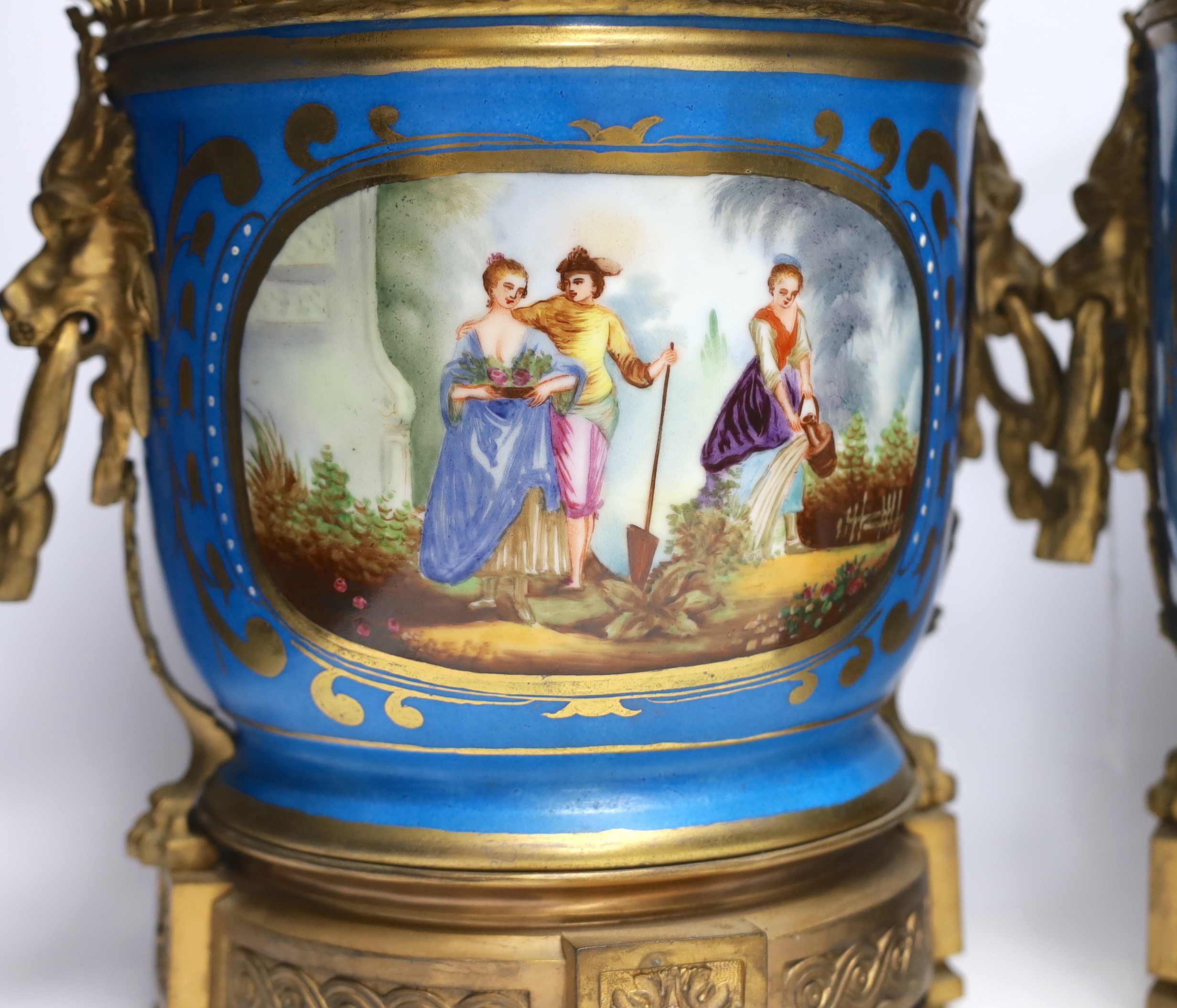 A pair of ormolu mounted Sevres style cache pots, 29cm high